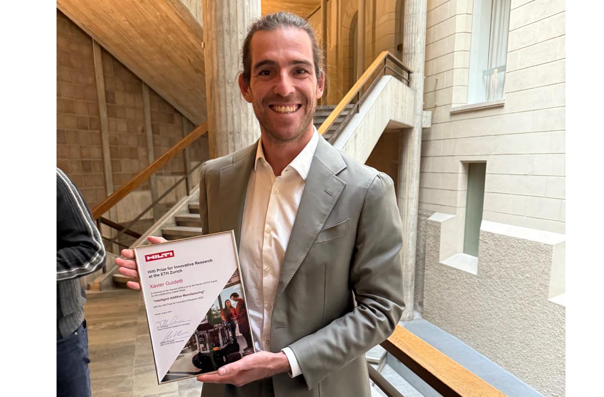 Photo of Xavier collecting his award