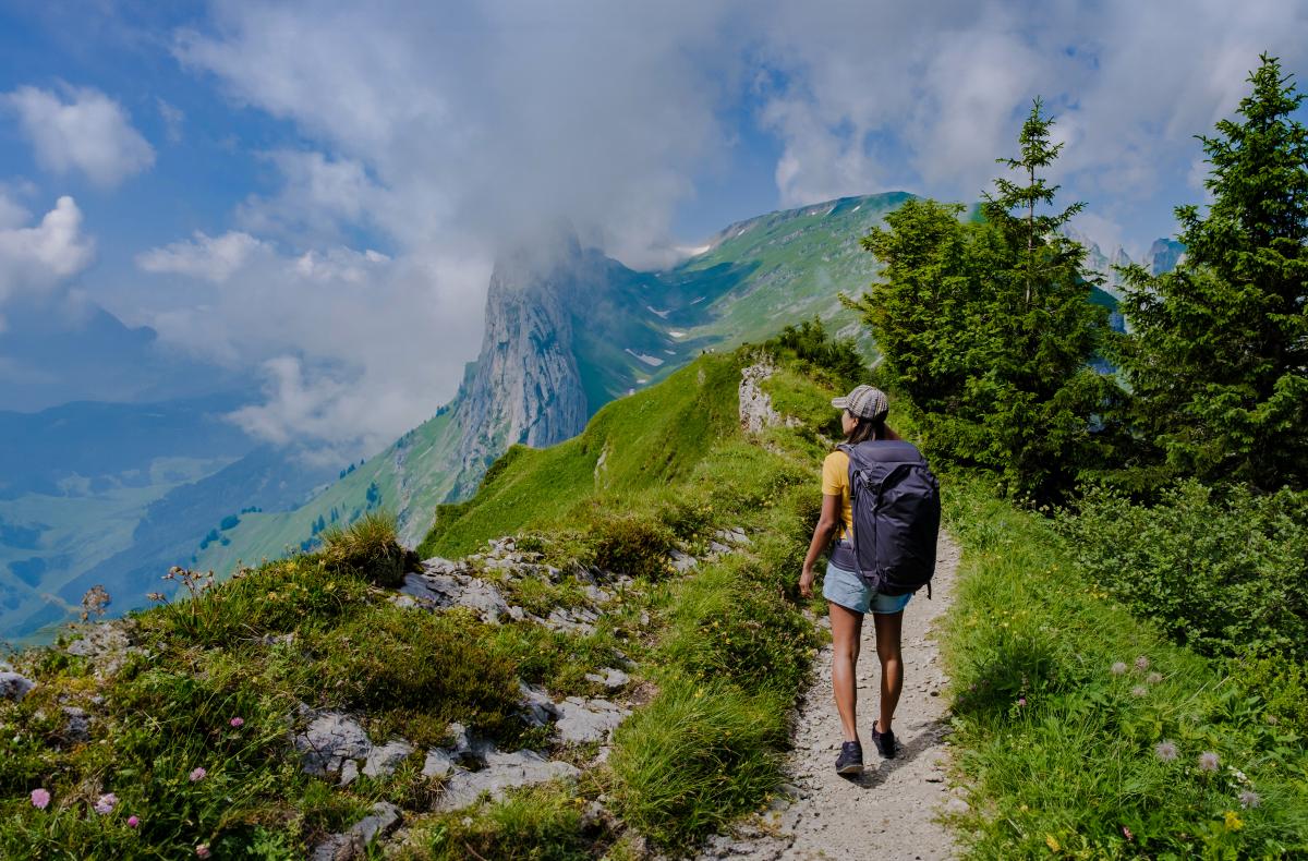 Photo of woman hiking in Swiss mountains