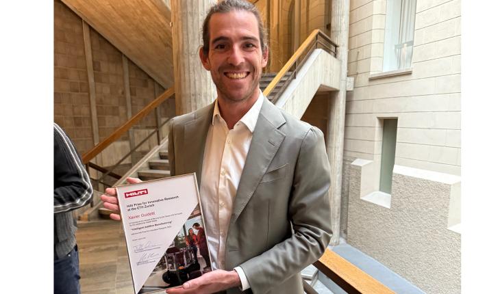 Photo of Xavier collecting his award