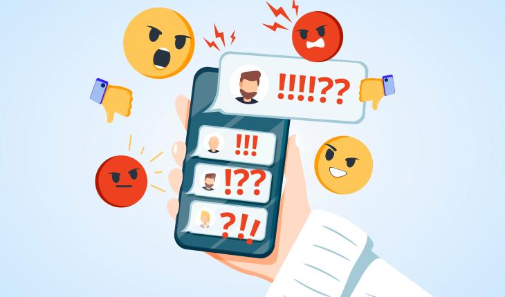  Heruntergeladen Hand holding phone with incoming bullying message in chat cartoon illustration